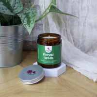 Sweet Wild Natural Wax Jar Candle - Forest Walk - A forest walk will make you feel alive. Stepping into a forest is like walking through a gate. You leave all the fuss and  busy life to be greeted with peace and fragrant nature. A meandering stroll through the FOREST WALK scent will be rewarded with a sparkling, citrusy aroma as you move deeper in. Exotic jasmine mingles with delicate white floral, and everything is anchored by soothing amber tones and dry cedarwood, patchouli, vanilla, and light musks.

Give the gift of serenity, of taking a moment to breathe, and of reconnecting with the beauty that lies both within and around us.

Crafted with natural wax, this non-toxic candle ensures a clean burn and the best candle experience.

Top notes: Bergamot, Eucalyptus, Thyme
Heart notes: Jasmin, Muguet, Cedarwood, Iriswood
Base notes: Patchouli, Cocoa, Amber, Tonka Bean

150gr - Approximately 35 hours burn.

Coconut and rapeseed wax candle with a cotton wick, poured in small batches.
Vegan friendly 

Free from additives, beeswax, palm, or soy.
Throws scent extremely well.
Paraben and Phthalates-free